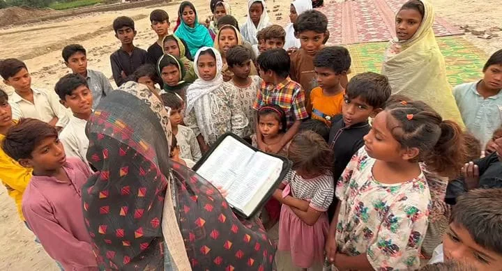A group gathered during an outdoor community visit