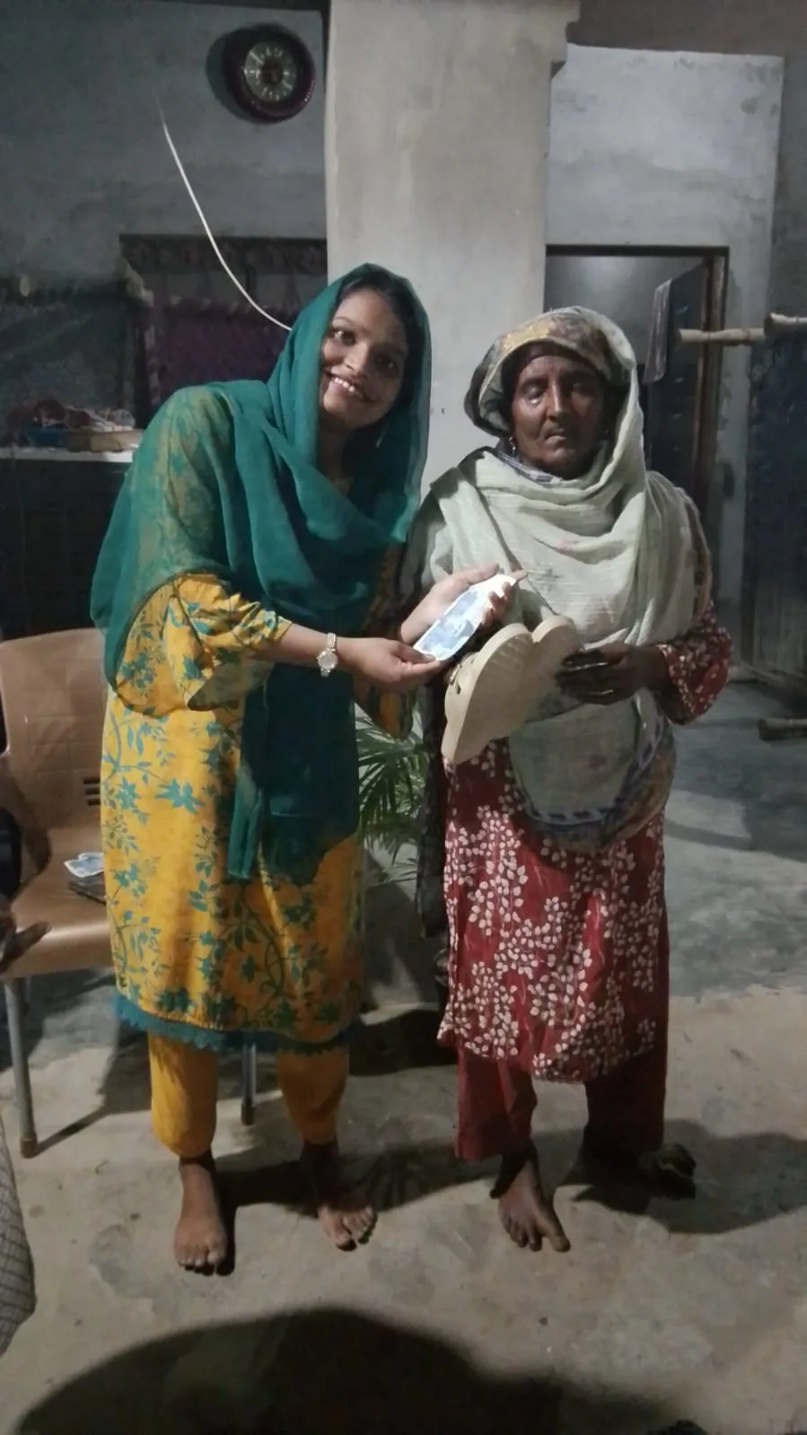 Community member receiving practical assistance in Pakistan