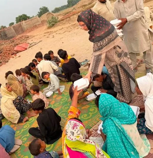 Community members sharing a meal outdoors